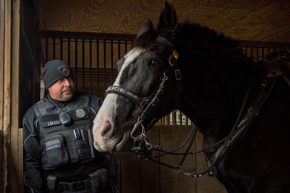 Mounted police officer Eric Lukacs and Liam